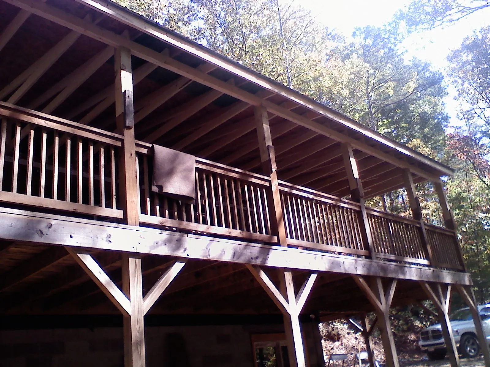 Timber framing under a new elevated porch and deck — Roof Leak Repair in New Palestine by Roofing Brothers